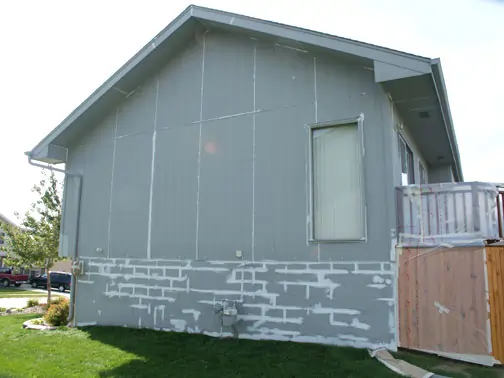 House Painting in Omaha NE, Siding with Oil-Based Primer and Foundation with Concrete Masonry Primer